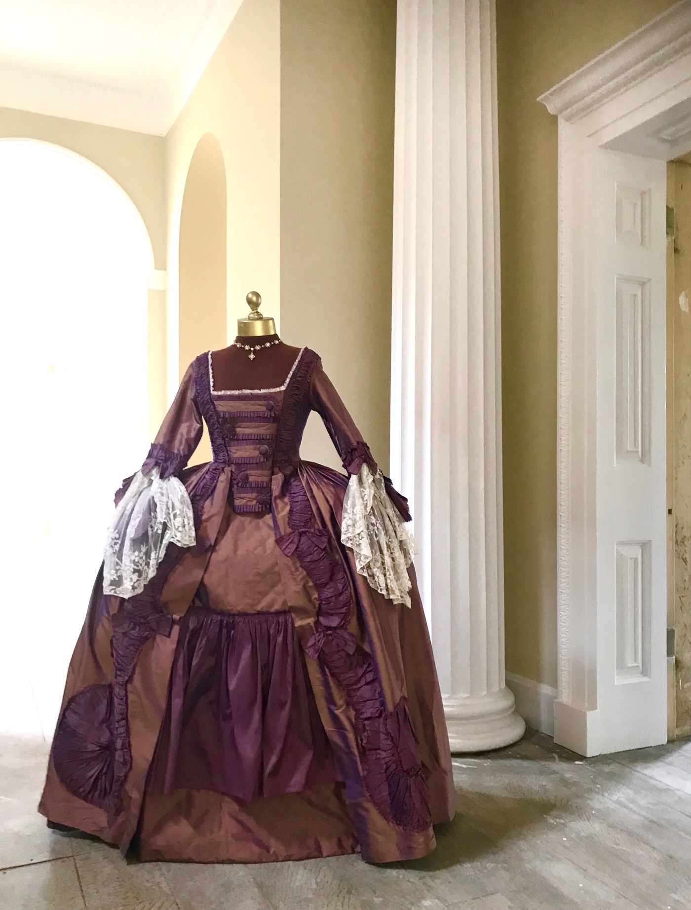 An exceptional lady's 18th century style sack dress, bronze and purple with fine lace cuffs - with skirt and pannier frame. Ex London Festival Opera 'The Magic Flute'.